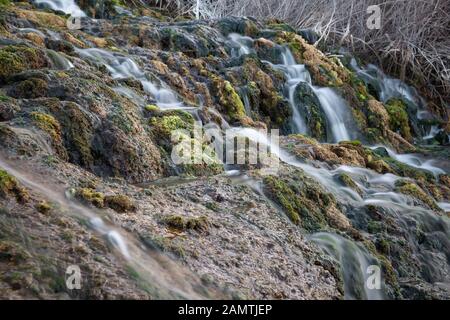 stone water channel full of running water in Tierra del Trigo village Stock Photo