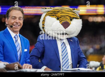 New Orleans, LA, USA. 13th Jan, 2020. ESPN analyst Lee Corso makes his pick by putting on the LSU Tiger head gear as Alabama Head Coach Nick Saban laughs during their pregame show before the College Football National Championship between the Clemson Tigers and the LSU Tigers at the Mercedes Benz Superdome in New Orleans, LA. Jonathan Mailhes/CSM/Alamy Live News Stock Photo