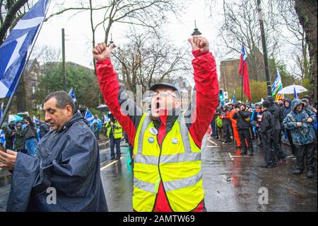 Glasgow, UK. 11th Jan, 2020. A steward raising his hands and shouting, commencing the march.80,000 supporters came out in support of Scottish Independence following the UK General Election and the upcoming date of January 31st when the UK will leave the European Union, dragging Scotland out of it against its will, as a result the group All Under One Banner held an Emergency march through the center of Glasgow to protest against both London rule and Brexit. Credit: SOPA Images Limited/Alamy Live News Stock Photo