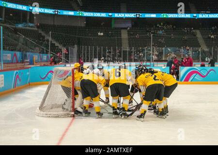 Lausanne, Switzerland. 13th Jan, 2020. The yellow team huddles before the women's mixed NOC 3-on-3 ice hockey preliminary round (game 28; brown v. yellow), during Day 4 of the Lausanne 2020 Winter Youth Olympic Games, at Lausanne Skating Arena. Credit: SOPA Images Limited/Alamy Live News Stock Photo