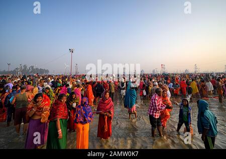 Namkhana, India. 14th Jan, 2020. NAMKHANA, INDIA - JANUARY 14 2020: Crowd of Hindu devotees during the festival.Gangasagar is one of the religious spots for Hindu Pilgrims situated at the Bay of Bengal where millions of devotees come to take a Holy bath annually during Makar Sankranti (Transition of the Sun) as per Hindu calendar and offer prayers to Kapil Muni Temple. The date for this Festival usually fall between 13 to 15 January of every year. Credit: SOPA Images Limited/Alamy Live News Stock Photo