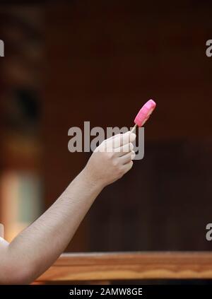 hand give ice cream in the afternoon Stock Photo