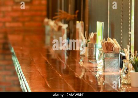 Paper napkin in a galvanized box on a wooden table Stock Photo