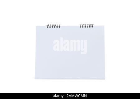 Blank paper desk spiral calendar on white background. Stock Photo