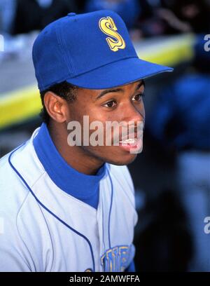 Cincinnati Reds Ken Griffey Jr. gets a hug from his father Ken