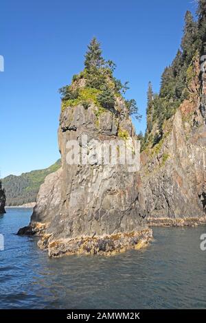 Sea Stack in Porcupine Bay in Kenai Fjords National Park In Alaska Stock Photo