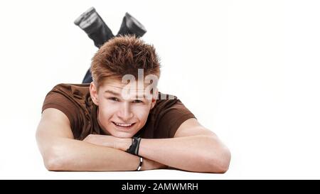 closeup. modern guy lying on the floor and looking at camera Stock Photo