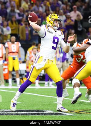 FILE - In this Jan. 1, 2019, file photo, LSU quarterback Joe Burrow attends  warmups before the Fiesta Bowl NCAA college football game against UCF in  Glendale, Ariz. This year, a group