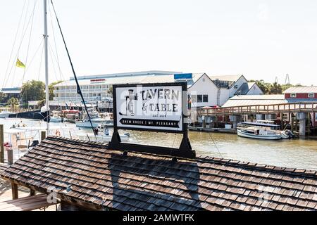 Mount Pleasant, USA - May 11, 2018: County of Charleston South Carolina area with restaurants on bay and sign for tavern on Shem Creek Stock Photo
