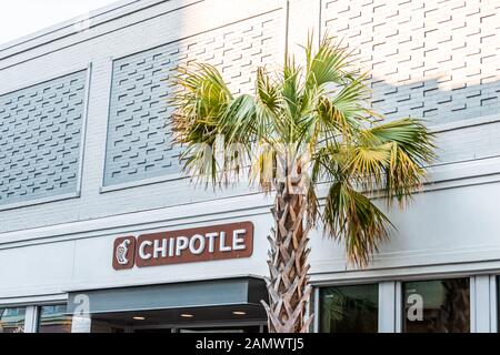 Charleston, USA - May 12, 2018: Downtown city King street in South Carolina in southern town with colorful building and sign for Chipotle restaurant Stock Photo