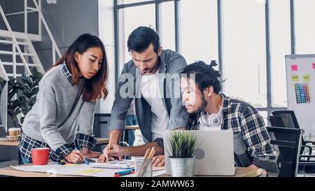 Creative designe team brainstrom branding project with designer team at meeting table with desktop computer.discussion idea in creative office Stock Photo