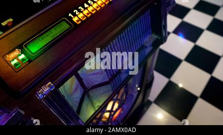 Antique music playing device in retro style cafe, vintage jukebox, old fashion Stock Photo