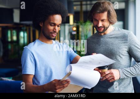 Young coworkers analyzing important documents Stock Photo