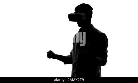 Young doctor wearing virtual reality goggles for operation simulation innovation Stock Photo