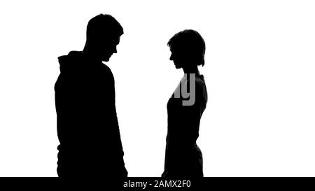 Profile of a couple silhouette looking each other at sunset on the ...