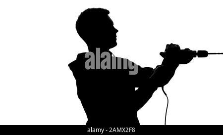Shadow of male construction worker drilling wall, repairman using instruments Stock Photo