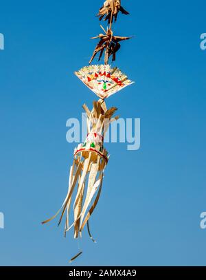 Traditional Balinese decoration blowing in the wind. Stock Photo