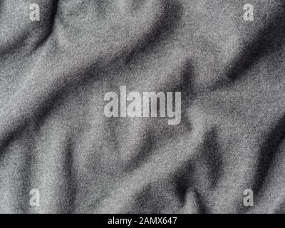 Gray cotton fabric texture. Clothes cotton jersey background with folds Stock Photo