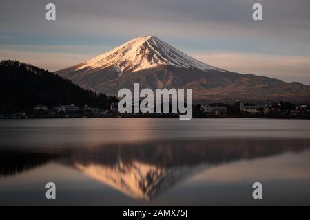 Mount Fuji reflected in Lake Kawaguchi at Sunrise Stock Photo