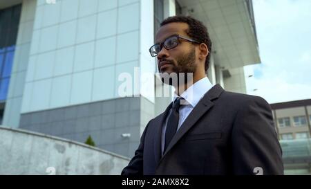 African-American businessman in eyeglasses, treatment blurred vision, eyesight Stock Photo