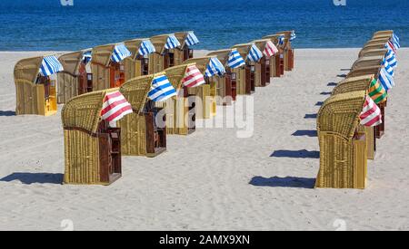 The spa beach is framed by the beach promenade and the Nordermole on the city side. Seven beach chair rentals with a total of around 1100 beach chairs. Stock Photo