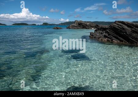 View of Japanese coast and nature near Furuzamami beach on Zamami island, Ryukyu archipelago, Okinawa, Japan, Asia. Crystal clear sea water with coral Stock Photo