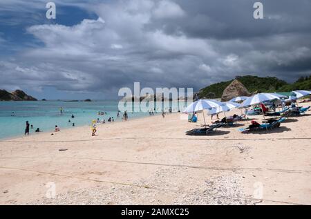 Aharen beach on Tokashiki island, Kerama archipelago, Okinawa, Japan, Asia. Japanese people swimming, tourists relaxing during vacation. Blue sea Stock Photo