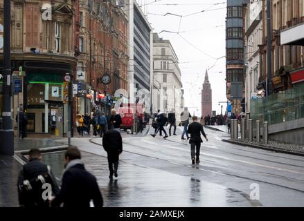 View towards Corporation Street in wet weather in winter, Birmingham city centre, UK Stock Photo