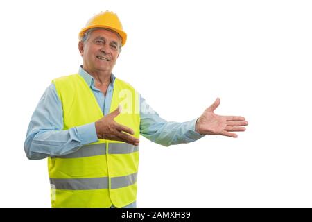 Old construction man worker with trustworthy expression presenting blank copyspace for advertising isolated on white Stock Photo