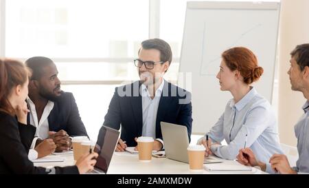 Multiracial team brainstorm cooperating at business office meeting Stock Photo