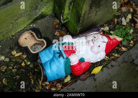 Broken gnome Stock Photo - Alamy