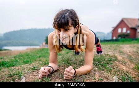 Female athlete training doing plank Stock Photo