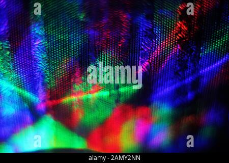 The wall is illuminated by multi-colored light sources. Beautiful abstract multicolored background. Stock Photo