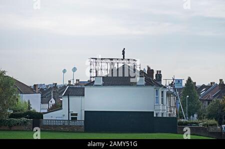 A scaffolder on top of scaffolding on a house in Bristol,UK Stock Photo