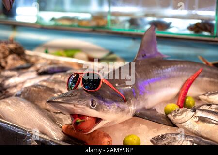 A baby shark on display at a local street food market in Phuket, Thailand. Stock Photo