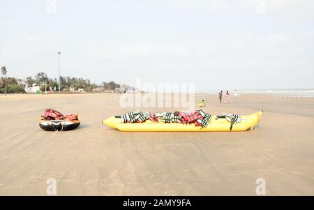 Inflatable adventurous fly fish raft of Fun Jet Ski watercraft wave runner vehicle placed in an empty sea beach for Jet skiing Water sports enthusiast Stock Photo