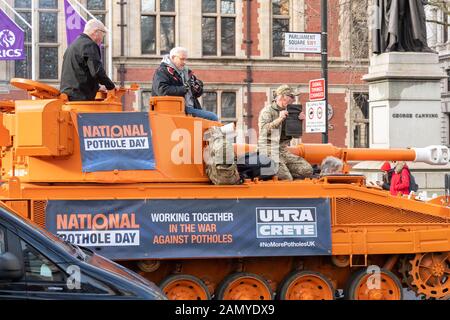 London UK 15th Jan. 2020 National Pothole day is celebrated by a bright orange tank being driven around the streets of Westminster, London UK Credit Ian DavidsonAlamy Live News Stock Photo