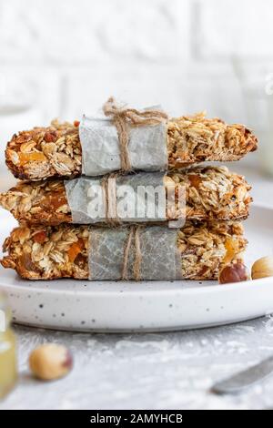 Homemade granola bars with pumpkin seeds and dried apricots from homemade granola. Simple and creepy snack. Alternative to purchased. Stock Photo