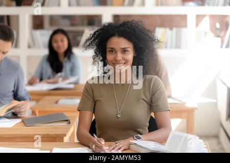 Portrait of smiling black female student posing for picture Stock Photo