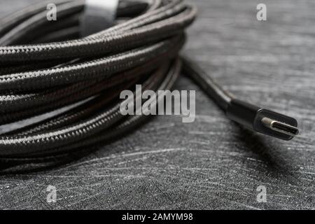 black type C cable on a dark background Stock Photo