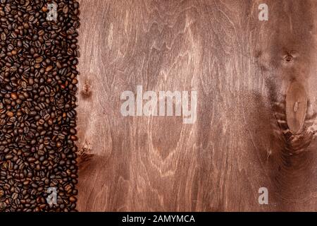 Coffee beans stripe on dark wooden texture background, Copyspace for text - image Stock Photo