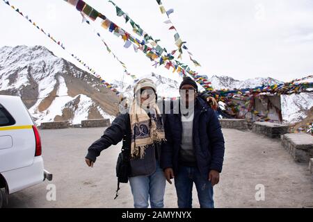 JAMMU KASHMIR, INDIA - MARCH 20 : Travelers thai women journey visit and posing portrait with Indian driver Thiksey monastery and Namgyal Tsemo Gompa Stock Photo