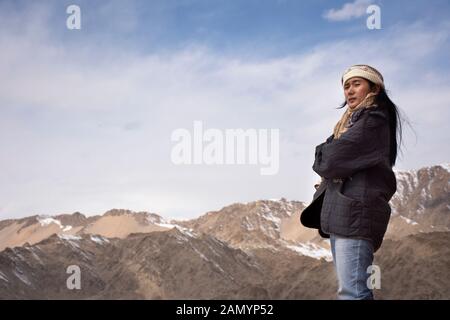 Travelers thai women people travel visit and posing with view landscape of Leh Ladakh Village from viewpoint of Thiksey monastery and Namgyal Tsemo Go Stock Photo