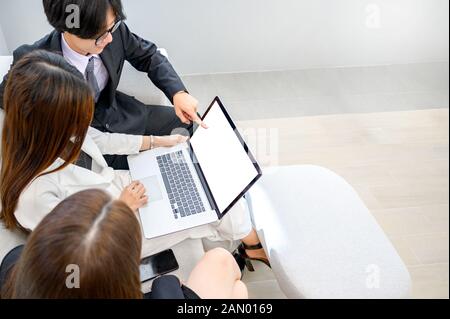 Business people are playing mobile phones and using computers Stock Photo