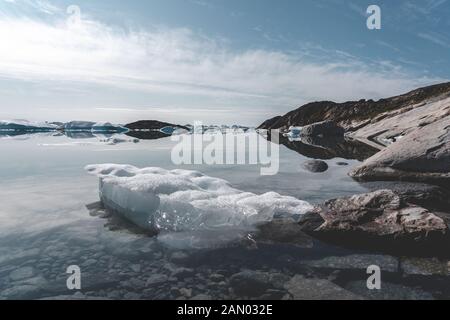Beautifull landscape with floating icebergs in glacier lagoon and lake in Greenland. Ilulissat Icefjord Glacier. Iceberg and ice from glacier in Stock Photo