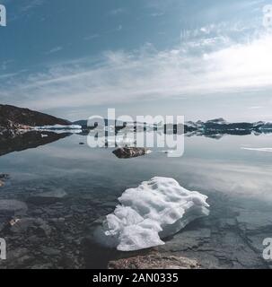Beautifull landscape with floating icebergs in glacier lagoon and lake in Greenland. Ilulissat Icefjord Glacier. Iceberg and ice from glacier in Stock Photo