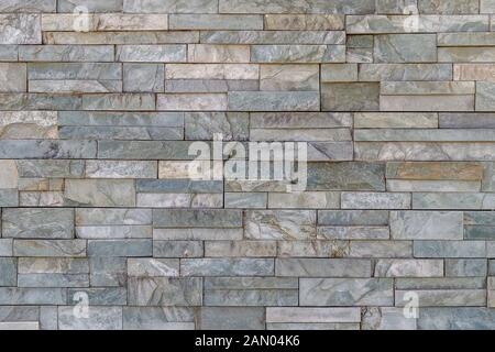 Natural stone wall backgraund, rock tiles texture Stock Photo