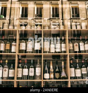 Wine bottles displayed in a shop in Paris Stock Photo