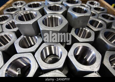 Nuts and bolts at industrial worksite. Stock Photo