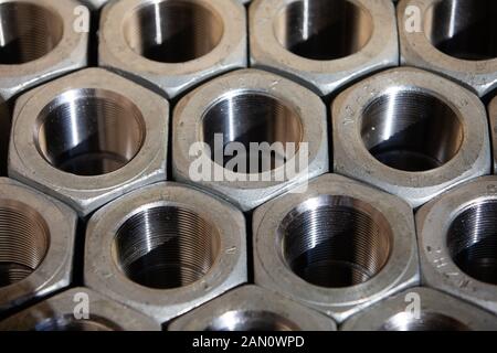 Nuts and bolts at industrial worksite. Stock Photo